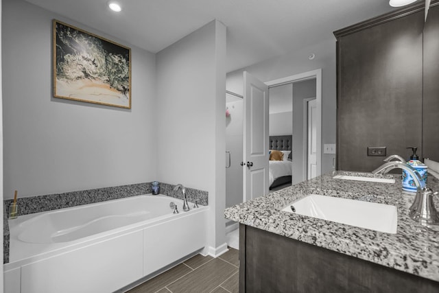 4014 River Valley Way, Eagan, MN 55122 - full bathroom featuring ensuite bath, a garden tub, baseboards, recessed lighting, and vanity