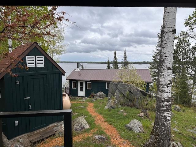 2377 Finn Bay Rd, Babbitt, MN 55706 - rear view of property featuring board and batten siding and metal roof