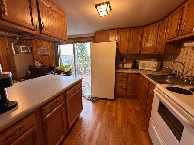 2377 Finn Bay Rd, Babbitt, MN 55706 - kitchen with white appliances, a sink, and brown cabinets