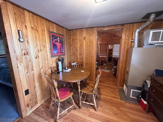 2377 Finn Bay Rd, Babbitt, MN 55706 - dining area featuring wood walls and light wood finished floors