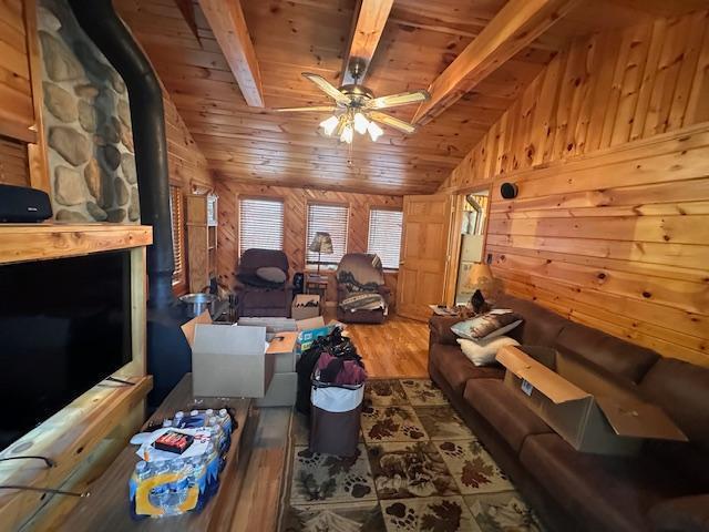 2377 Finn Bay Rd, Babbitt, MN 55706 - living area with wooden ceiling, wood finished floors, wooden walls, and ceiling fan