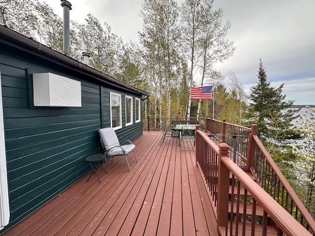 2377 Finn Bay Rd, Babbitt, MN 55706 - wooden deck with outdoor dining area and stairway
