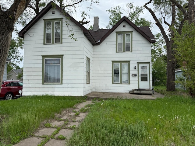2812 6th Ave, Anoka, MN 55303 - view of front facade with a chimney and roof with shingles