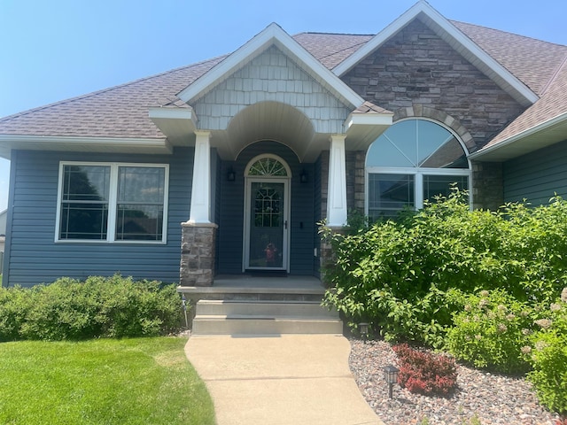 1808 4th St NE, Willmar, MN 56201 - property entrance featuring stone siding and roof with shingles