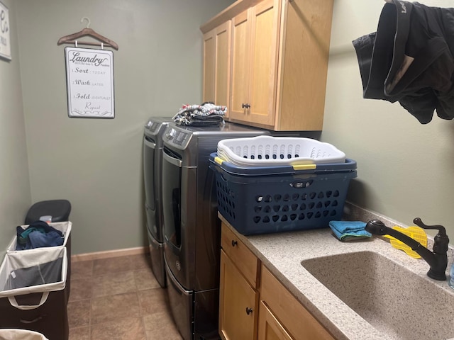 1808 4th St NE, Willmar, MN 56201 - laundry room featuring independent washer and dryer, cabinet space, and baseboards
