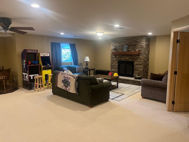 1808 4th St NE, Willmar, MN 56201 - carpeted living area featuring a ceiling fan, a stone fireplace, and recessed lighting