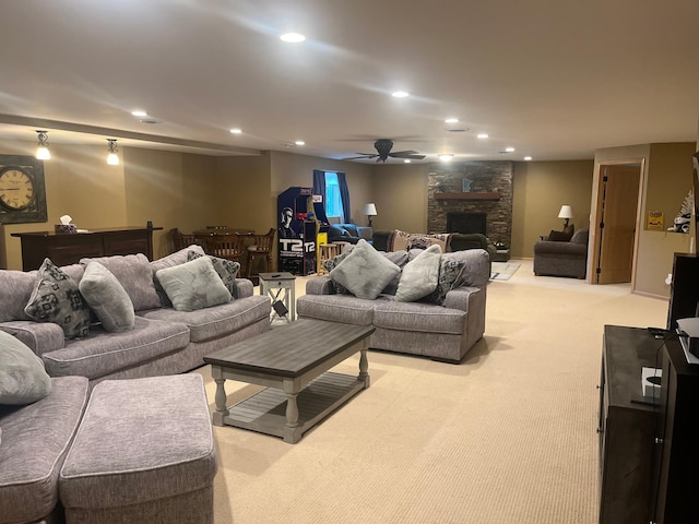 1808 4th St NE, Willmar, MN 56201 - living room featuring light colored carpet, recessed lighting, a ceiling fan, and a stone fireplace