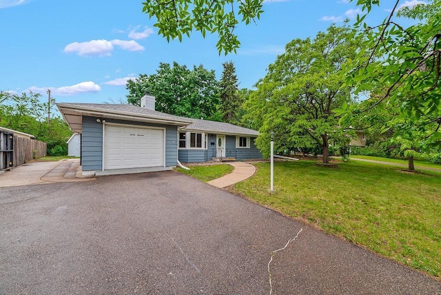 3013 64th Ave N, Brooklyn Center, MN 55429 - ranch-style home featuring an attached garage, a chimney, and asphalt driveway