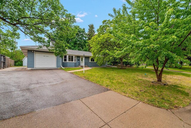 3013 64th Ave N, Brooklyn Center, MN 55429 - view of front of home with a garage and driveway