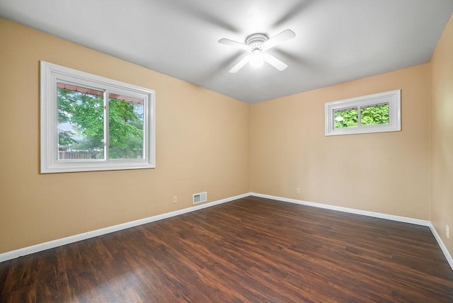 3013 64th Ave N, Brooklyn Center, MN 55429 - unfurnished room featuring baseboards, dark wood-style flooring, and ceiling fan