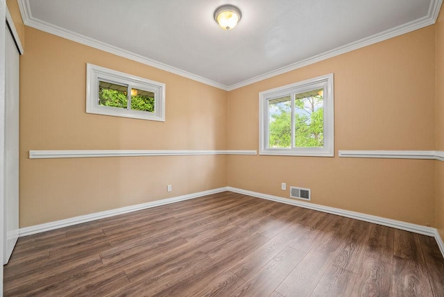 3013 64th Ave N, Brooklyn Center, MN 55429 - unfurnished room featuring baseboards, wood finished floors, and ornamental molding