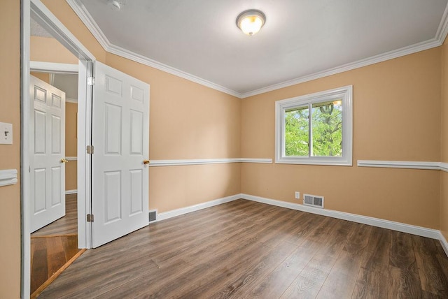 3013 64th Ave N, Brooklyn Center, MN 55429 - unfurnished room featuring wood finished floors, baseboards, and crown molding