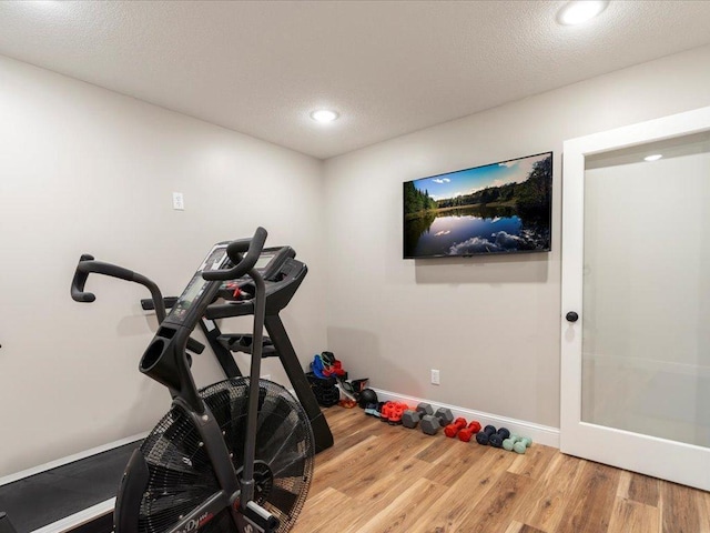 16524 Piper Ln, Brainerd, MN 56401 - workout room featuring wood finished floors, baseboards, and recessed lighting