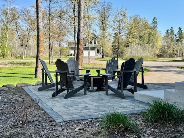 16524 Piper Ln, Brainerd, MN 56401 - view of patio featuring an outdoor fire pit