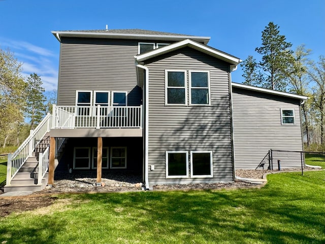 16524 Piper Ln, Brainerd, MN 56401 - back of house featuring a wooden deck, a lawn, and stairway