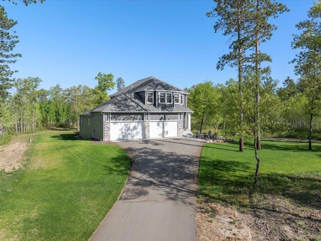 16524 Piper Ln, Brainerd, MN 56401 - view of front of property featuring asphalt driveway, a front yard, and an attached garage