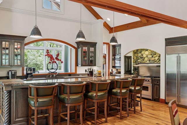 2442 Meeting St, Minnetonka, MN 55391 - bar area with high end appliances, a sink, high vaulted ceiling, beamed ceiling, and light wood-style floors