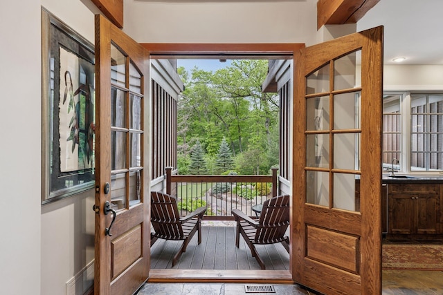 2442 Meeting St, Minnetonka, MN 55391 - doorway featuring a sink, wood-type flooring, and healthy amount of natural light