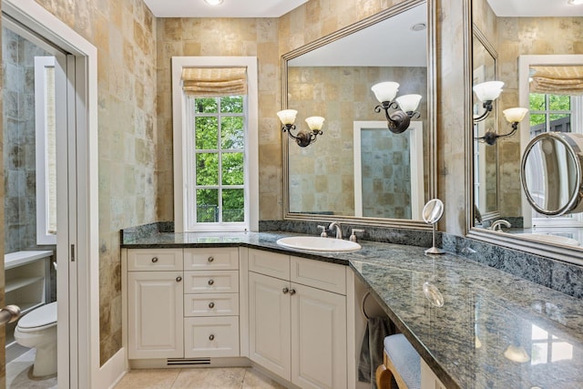 2442 Meeting St, Minnetonka, MN 55391 - bathroom featuring vanity, toilet, and tile patterned flooring