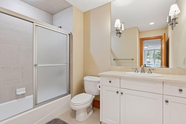 2442 Meeting St, Minnetonka, MN 55391 - bathroom featuring toilet, tile patterned floors, vanity, enclosed tub / shower combo, and recessed lighting