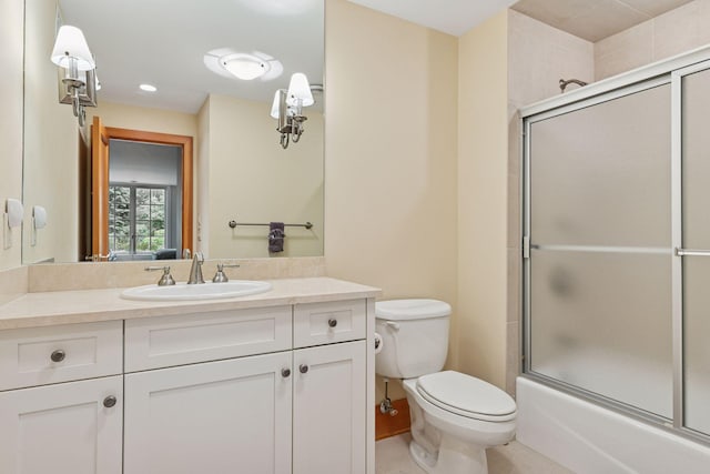2442 Meeting St, Minnetonka, MN 55391 - bathroom with vanity, toilet, and shower / bath combination with glass door