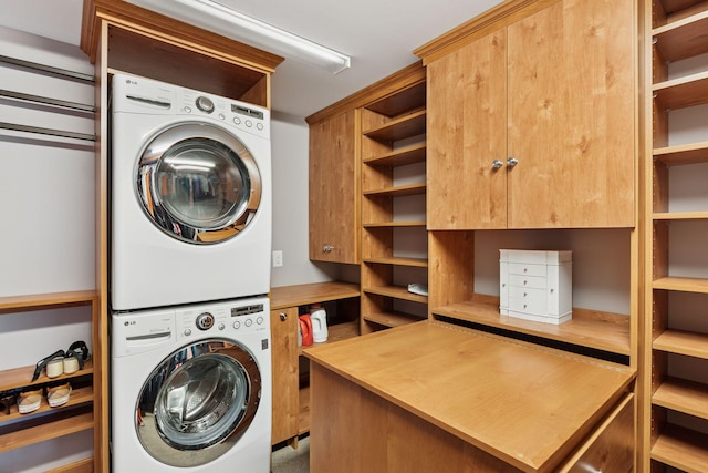 2442 Meeting St, Minnetonka, MN 55391 - washroom featuring stacked washer / drying machine and cabinet space