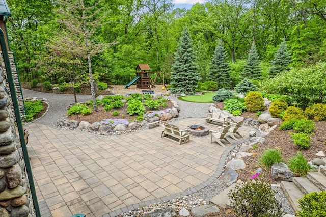 2442 Meeting St, Minnetonka, MN 55391 - view of patio / terrace with a playground and an outdoor fire pit