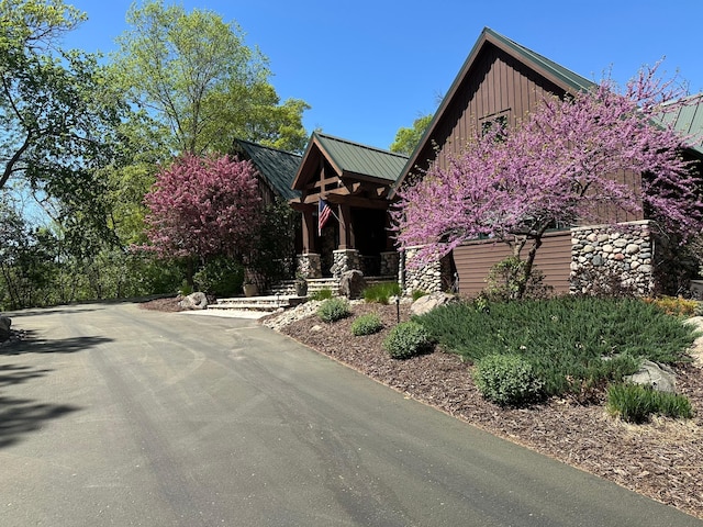 2442 Meeting St, Minnetonka, MN 55391 - view of front of property featuring board and batten siding and metal roof