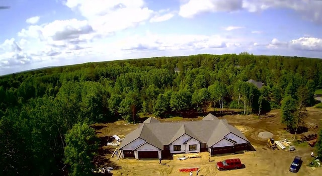 view from above of property with a forest