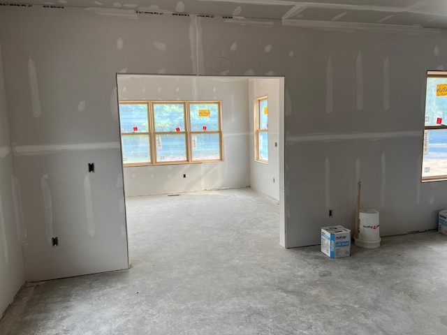 empty room with concrete flooring