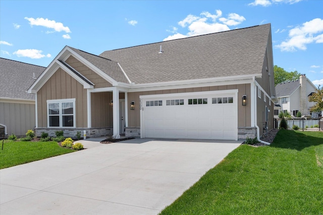 2300 Old Bridge Ln, Hastings, MN 55033 - view of front of home with a garage, stone siding, board and batten siding, and driveway