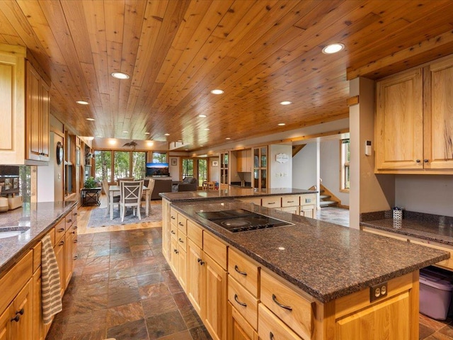 27620 Island View Dr, Park Rapids, MN 56470 - kitchen with black electric stovetop, recessed lighting, stone tile flooring, open floor plan, and wooden ceiling
