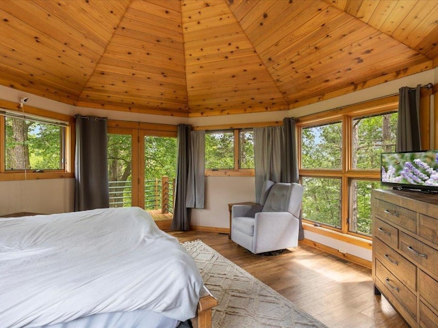 27620 Island View Dr, Park Rapids, MN 56470 - bedroom featuring vaulted ceiling, baseboards, wooden ceiling, wood finished floors, and access to exterior
