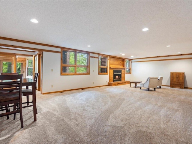 27620 Island View Dr, Park Rapids, MN 56470 - unfurnished living room with recessed lighting, baseboards, light colored carpet, ornamental molding, and a fireplace