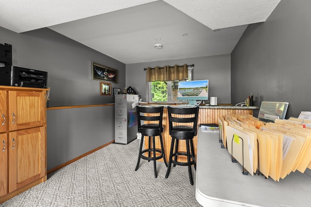 14465 Blackberry Ct, Baxter, MN 56425 - dining space with a dry bar, baseboards, light colored carpet, and a textured ceiling