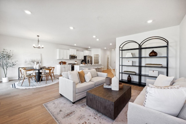 6570 Jody Ave S, Cottage Grove, MN 55016 - living room featuring a chandelier, light wood finished floors, recessed lighting, and baseboards