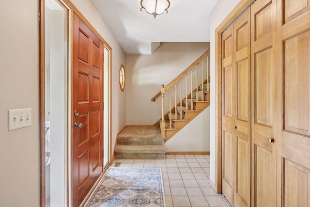 4650 Cottonwood Ln N, Plymouth, MN 55442 - foyer entrance featuring stairway and light tile patterned floors