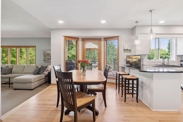 4650 Cottonwood Ln N, Plymouth, MN 55442 - dining space with healthy amount of natural light, light wood-type flooring, recessed lighting, and a textured ceiling