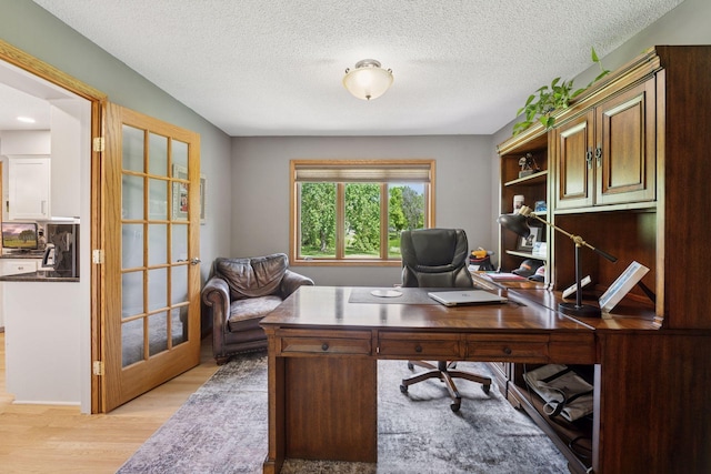 4650 Cottonwood Ln N, Plymouth, MN 55442 - office space featuring light wood-style floors and a textured ceiling