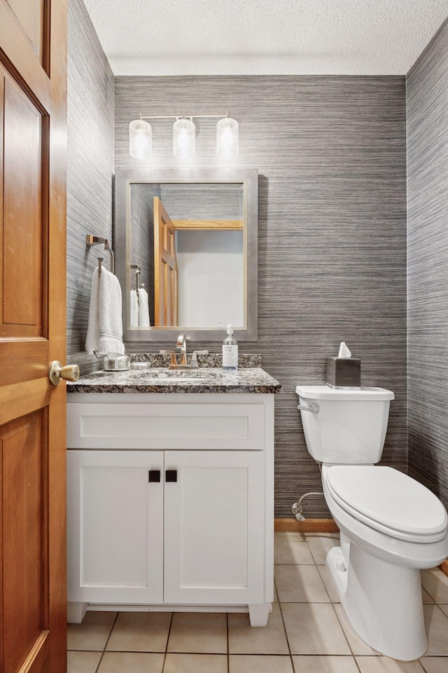 4650 Cottonwood Ln N, Plymouth, MN 55442 - half bath featuring tile patterned floors, vanity, wallpapered walls, and a textured ceiling