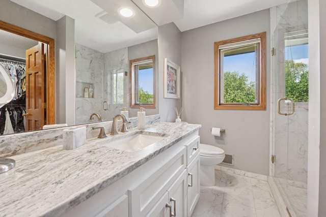 4650 Cottonwood Ln N, Plymouth, MN 55442 - bathroom featuring marble look tiles, vanity, a marble finish shower, a walk in closet, and recessed lighting