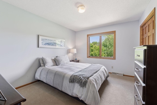 4650 Cottonwood Ln N, Plymouth, MN 55442 - carpeted bedroom with a textured ceiling