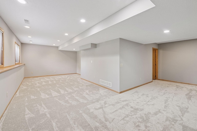 4650 Cottonwood Ln N, Plymouth, MN 55442 - finished below grade area with light colored carpet and recessed lighting