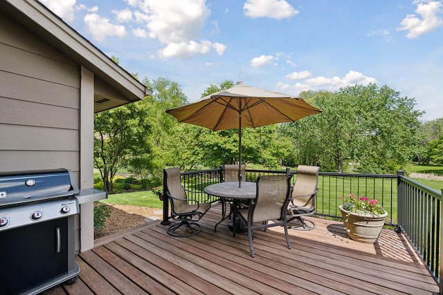 4650 Cottonwood Ln N, Plymouth, MN 55442 - deck with a grill, outdoor dining area, a lawn, and view of wooded area