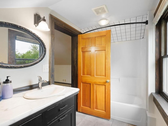 601 Kingsway Dr, Le Sueur, MN 56058 - full bathroom featuring vanity, tile patterned floors, and  shower combination