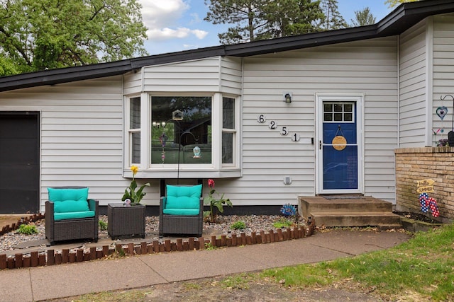 entrance to property featuring central air condition unit