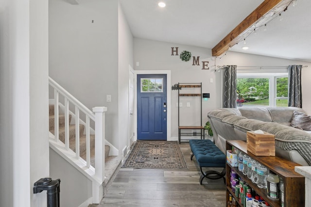 foyer entrance with wood finished floors, stairway, recessed lighting, and baseboards
