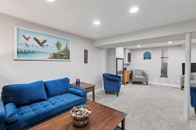 carpeted living room with recessed lighting and baseboards