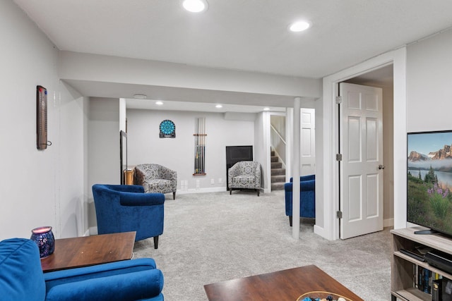 living area featuring light carpet, stairway, recessed lighting, and baseboards