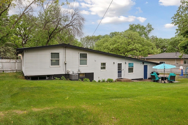 rear view of property with central AC unit